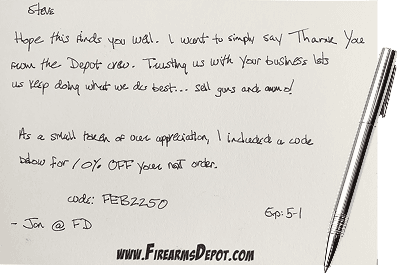 A handwritten card with a personal note and offer code, written with a real pen